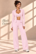 Front view of the Blush Eterno pink three-piece set with jacket, cropped top and wide-leg pants