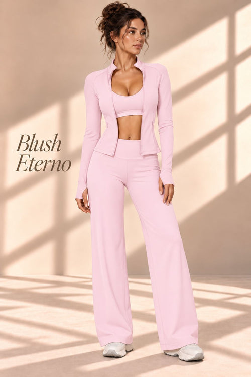 Front view of the Blush Eterno pink three-piece set with jacket, cropped top and wide-leg pants