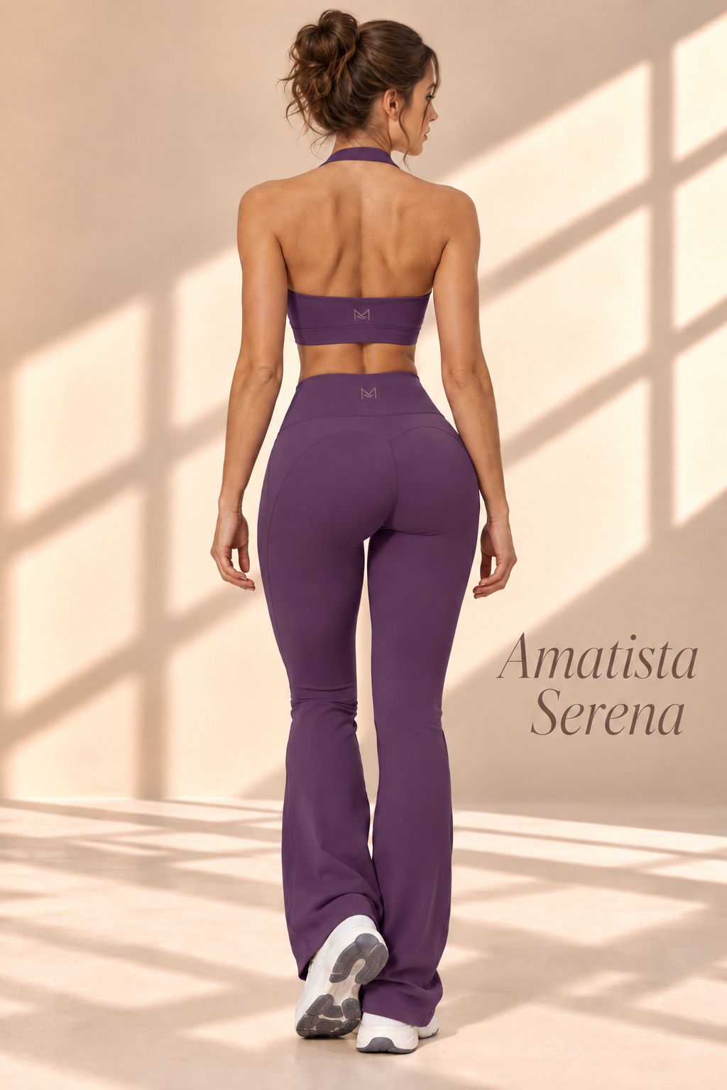 Front view of Amatista Serena purple halter crop top and high-waisted flare pants