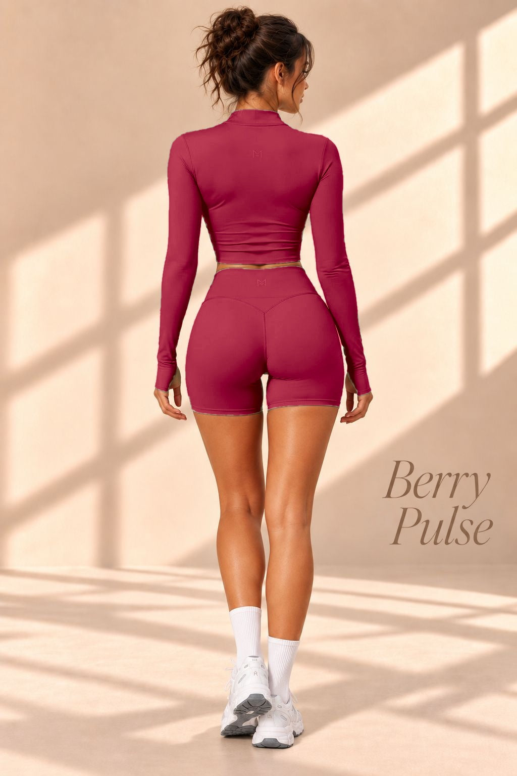 Back view of Berry Pulse berry cropped jacket and high-waisted shorts