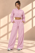 Front view of Blossom Track pink set with cropped zip-front jacket and wide-leg pants with pockets