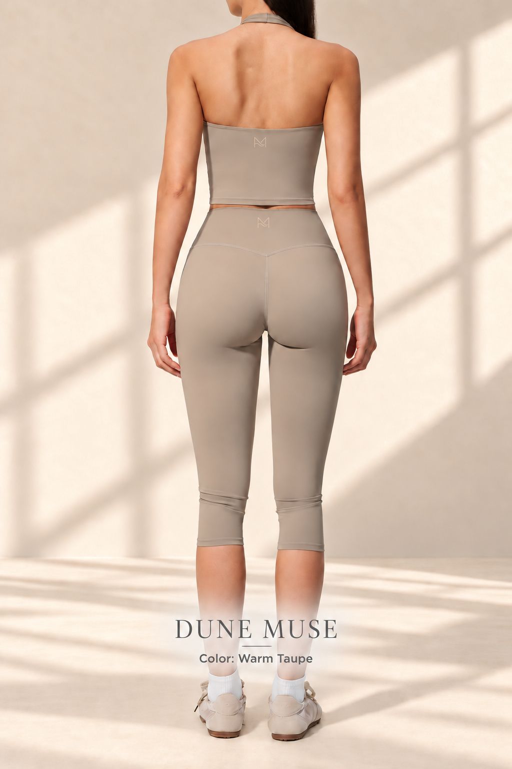 Back view of Dune Muse open-back halter crop top and matching capri leggings