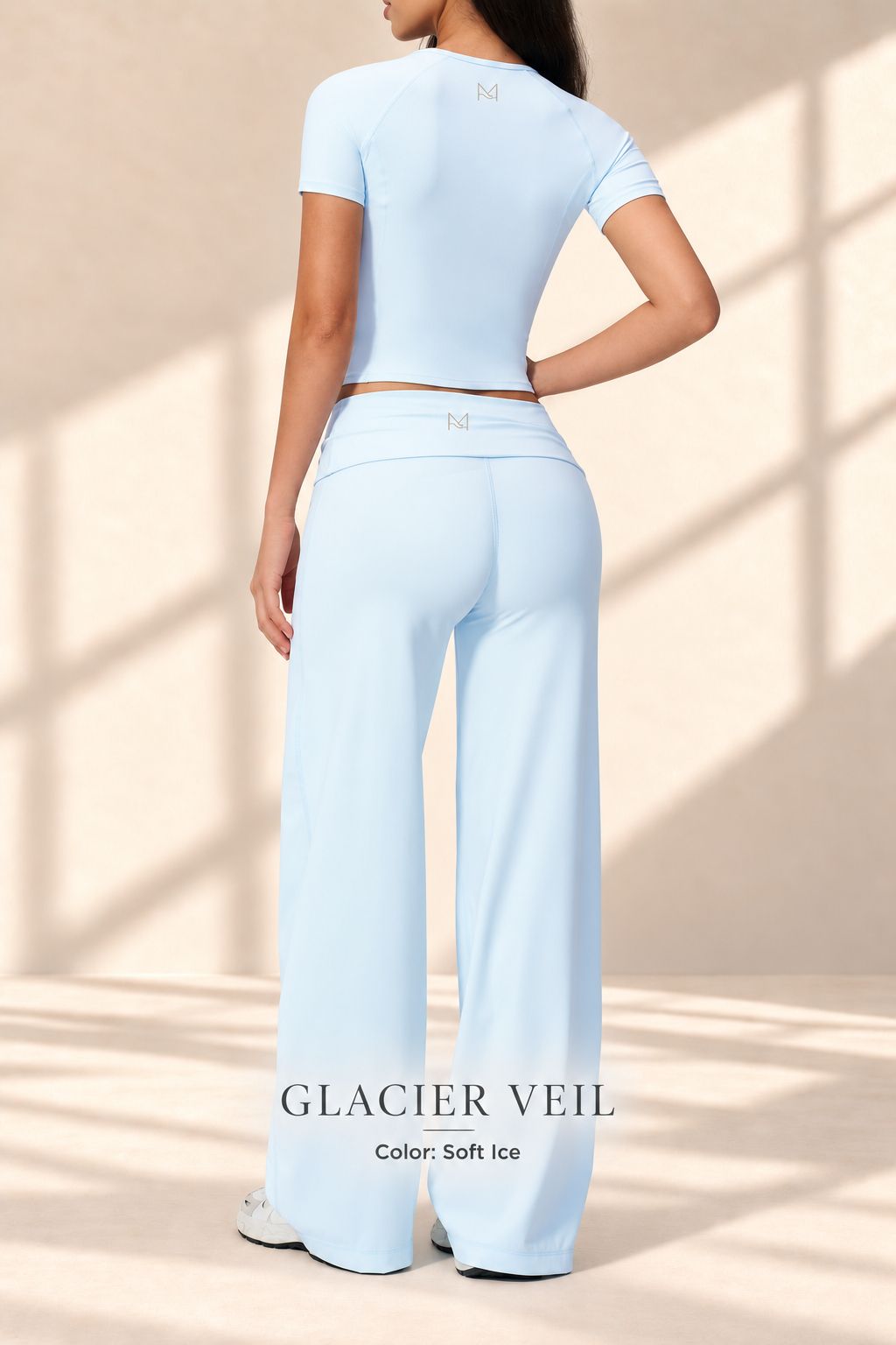Back view of Glacier Veil ice-blue crop top and full-length wide-leg pants
