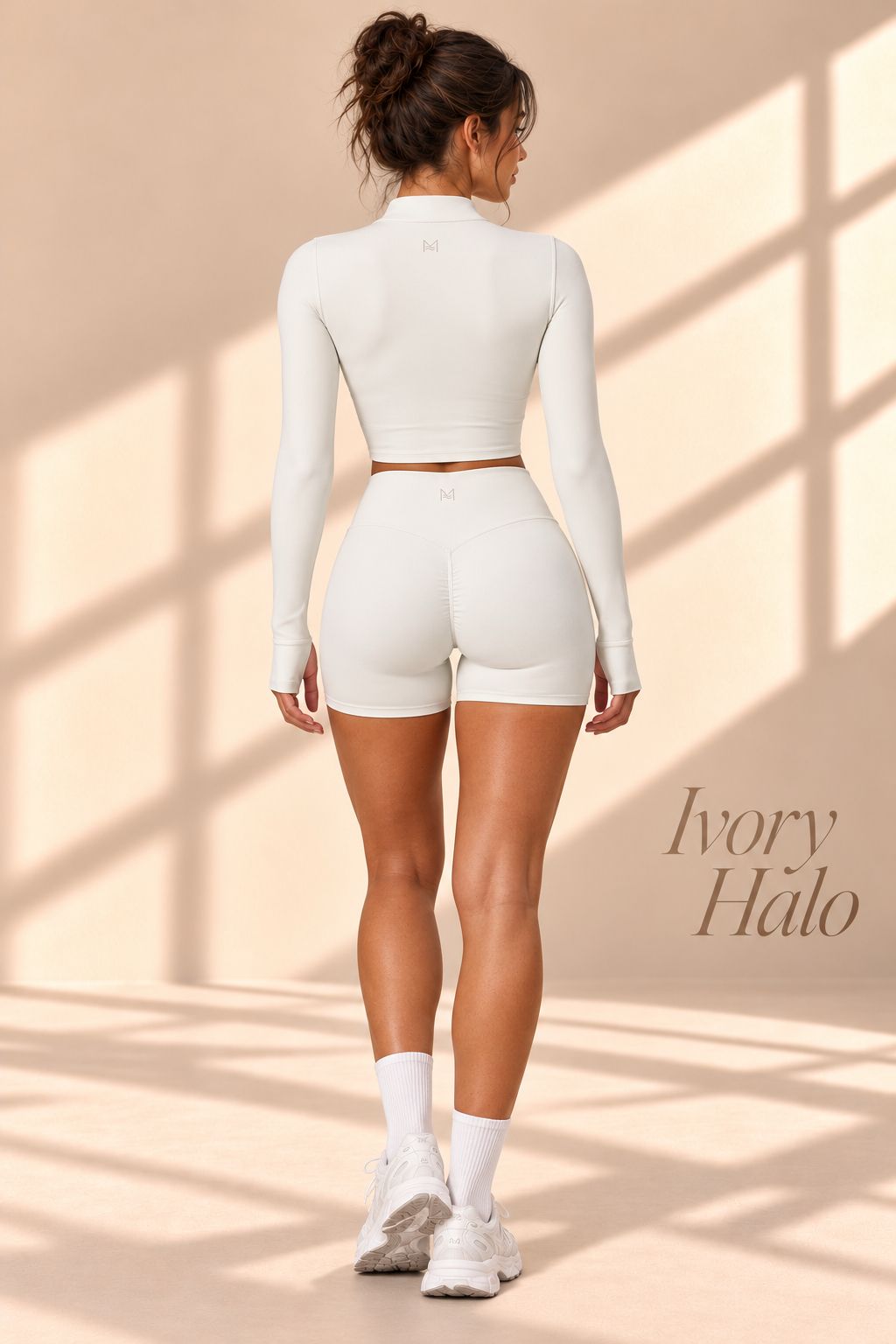 Back view of Ivory Halo ivory long-sleeve cropped jacket and matching shorts