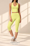 Front view of Limone Silk key-lime halter crop top and capri leggings