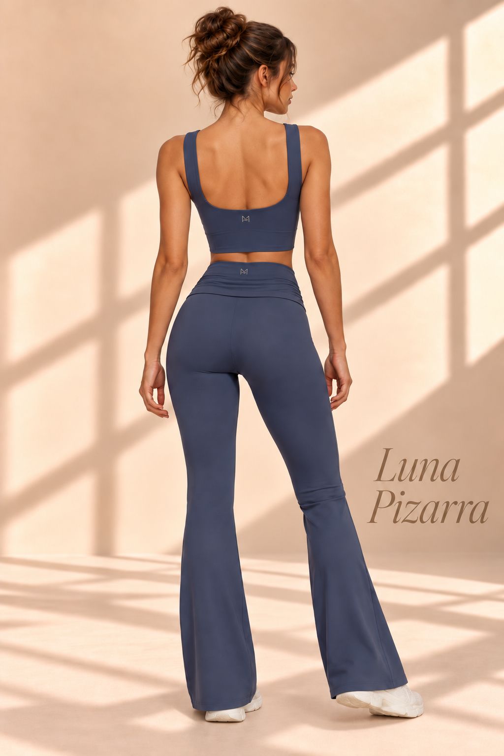 Back view of Luna Pizarra slate-blue scoop-back crop top and matching flare pants