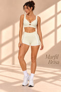 Front view of Marfil Brisa ivory twist-front crop top and matching high-waisted shorts
