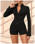 Front view of Noir Belle black set with zip-front bell-sleeve top and matching shorts