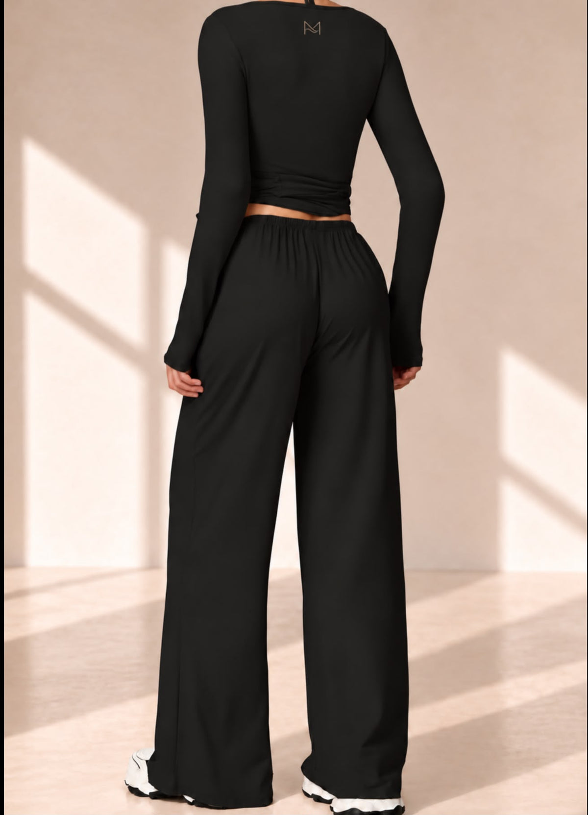 Back view of Onyx Ribbon black set with long-sleeve top and wide-leg pants