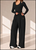 Front view of Onyx Ribbon black three-piece set with tie-front wrap top and wide-leg pants