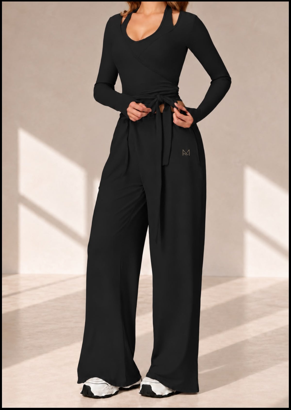 Front view of Onyx Ribbon black three-piece set with tie-front wrap top and wide-leg pants