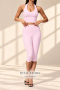Back view of Petal Etoile soft-pink open-back halter top and matching capri leggings