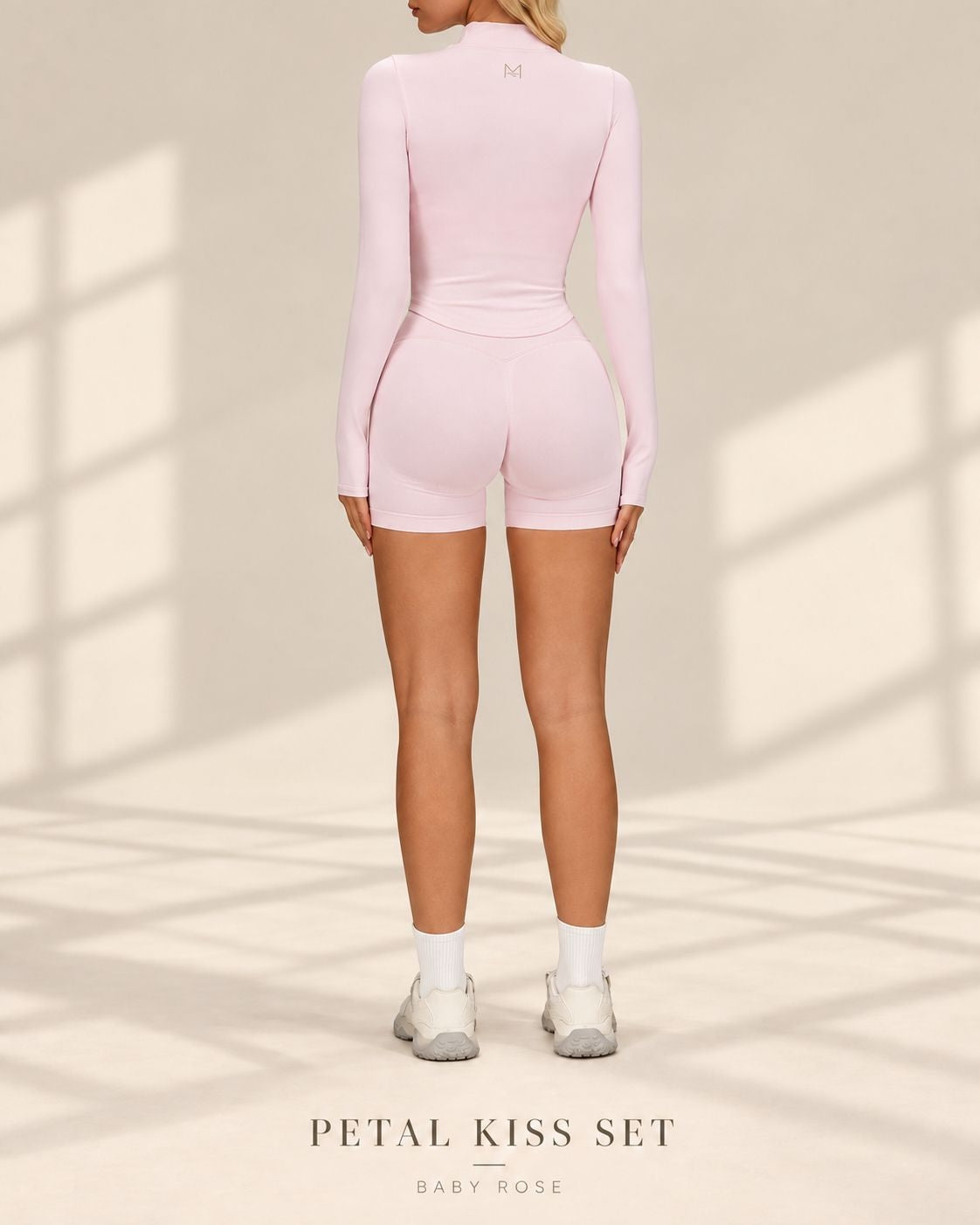 Back view of Petal Kiss Set in Baby Rose showing long-sleeved jacket and fitted shorts