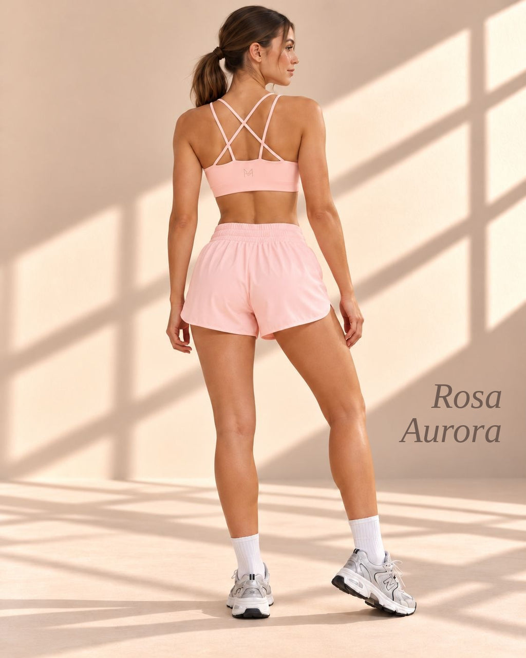 Back view of Rosa Aurora pink crop top with crisscross straps and matching shorts