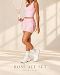 Front view of Rosé Ace Set in Ballet Pink with cropped top and side-tie shorts