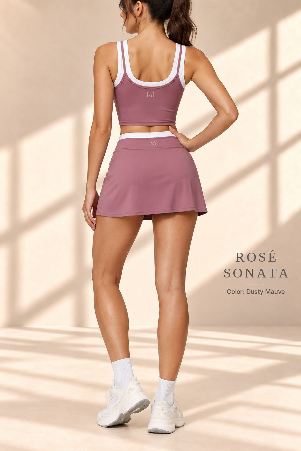 Front view of Rosé Sonata dusty-mauve crop top and A-line mini skirt with white trim