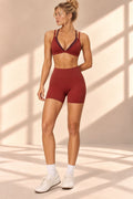 Front view of Rust Layer red set with contrast-trim strappy top and high-waisted shorts