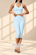 Front view of Sky Allure light-blue halter crop top and capri leggings